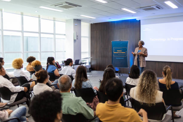 istock Middle-aged black woman giving lecture in auditorium 1493549179