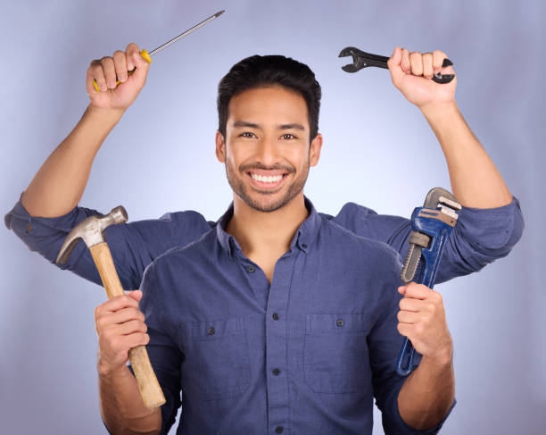 handyman, builder tools and portrait of mulitask engineering of a man ready for construction work. diy, home renovation project and happiness of a model with isolated studio background with arms - home improvement work tool hammer portrait imagens e fotografias de stock