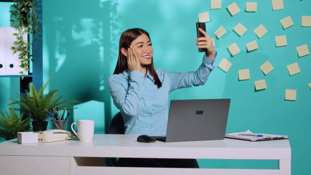 istock Employee taking peace sign photo selfies 1493555354
