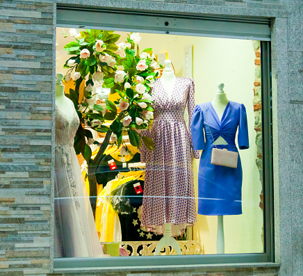 Store window, women fashion retail display. women formal fashion clothing, on mannequin.
