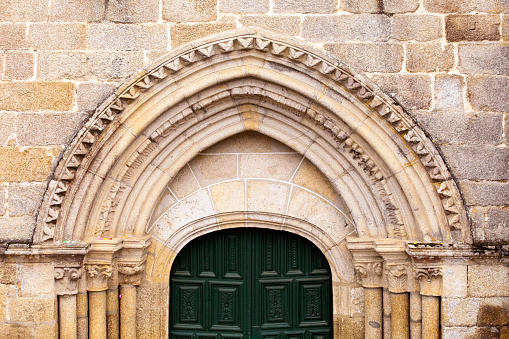 Close-up view of old stone  doorway arches in San Clodio monastery church, 13th century, Leiro, Ourense province, Galicia, Spain.