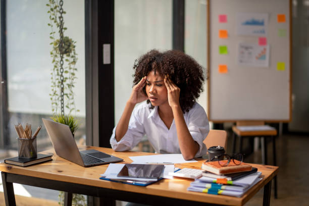 istock Black woman working on a computer screen and stressed out about the task in front of her. 1493561122