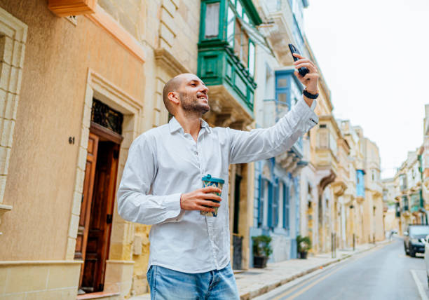 istock Young man taking selfies in Valletta, Malta 1493562544