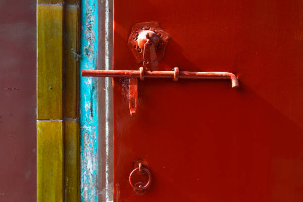 Decorative ceramic bell in India on red wall background