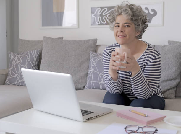 istock Happy trendy middle aged woman remote working 1493569785
