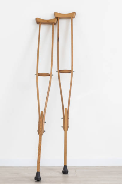istock Crutches. physical disability. Empty living room with walking support for transportation and accessibility. Medical equipment helping with mobility. Close up. 1493570436
