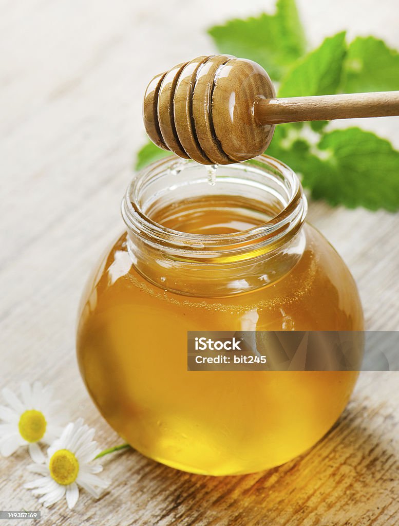 honey in glass jars Chamomile Plant Stock Photo