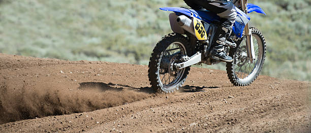 istock Motocross motorcycle tires kicking up Dirt 149357286