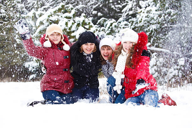istock Teenage  friends throwing snow 149357292