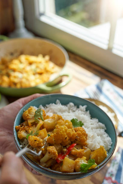 istock Indian Vegan Aloo Gobi Dish with Potatoes and Cauliflower 1493574601