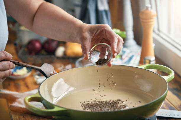 istock Preparing Indian Vegan Aloo Gobi Dish with Potatoes and Cauliflower 1493574646
