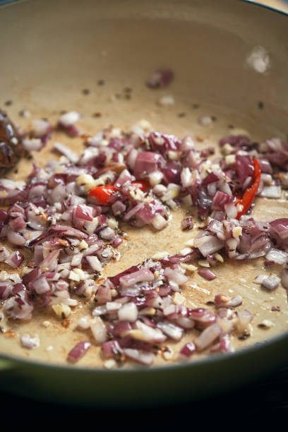 istock Preparing Indian Vegan Aloo Gobi Dish with Potatoes and Cauliflower 1493574655