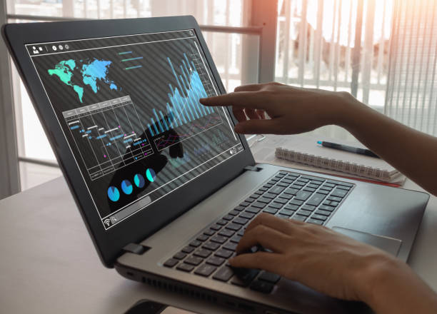 istock Business people analyzing the financial data graph and pointing to the laptop computer screen. Business strategic planning, research information data analysis technology and financial growth concept. 1493574886
