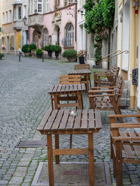istock Outdoor seating area is pictured with several tables and chairs. Lindau, Germany. 1493579988