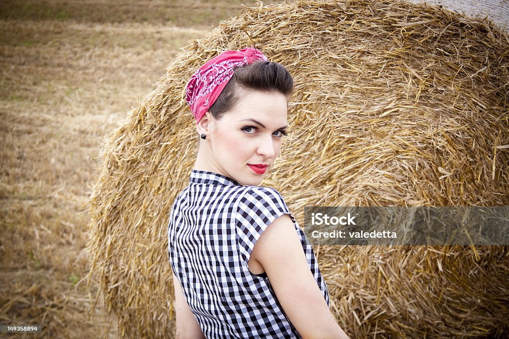 beautiful rockabilly girl in the field beautiful rockabilly girl in the field looking at camera. One Woman Only Stock Photo