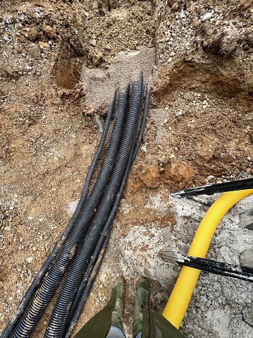 ductwork cables laying on the ground at construction site