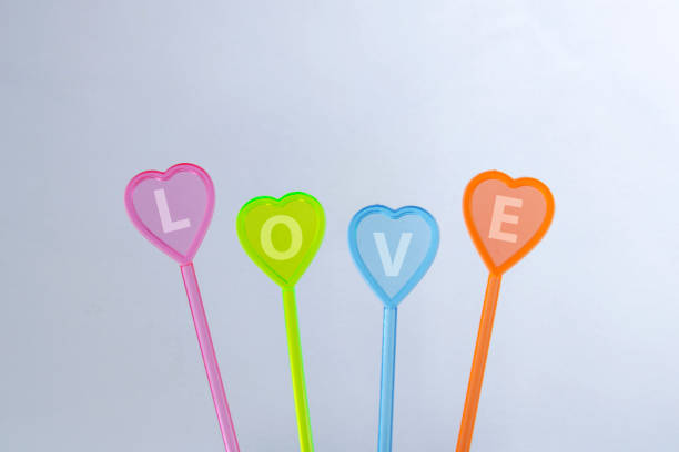 Word love on hearts of different colors