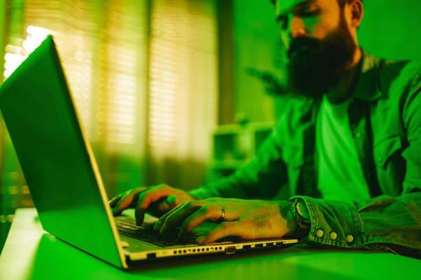 istock Selective focus on data entry expert typing on a keyboard in a green-lighted home office. 1493591805