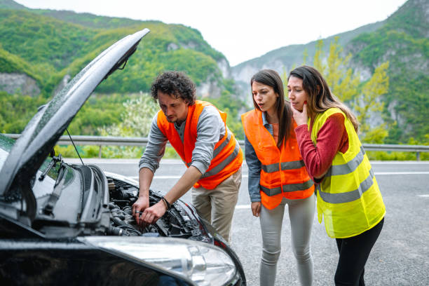 istock Fiends on road trip had a car breakdown and checking car engine 1493593788