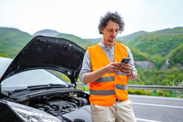 istock Man had a car breakdown and calling roadside assistance. 1493593812