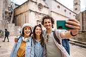 Three young tourists taking selfie in Dubrovnik