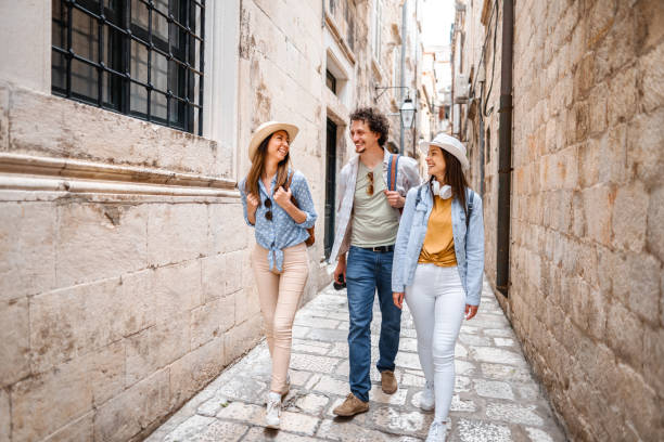 istock Three smiling tourists exploring the city 1493593981