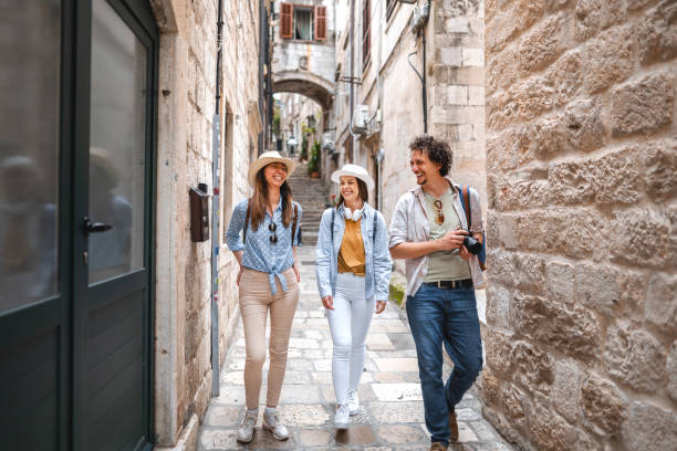 istock Three smiling tourists exploring the city 1493594006