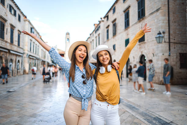 istock Two young female tourists exploring the city 1493596393