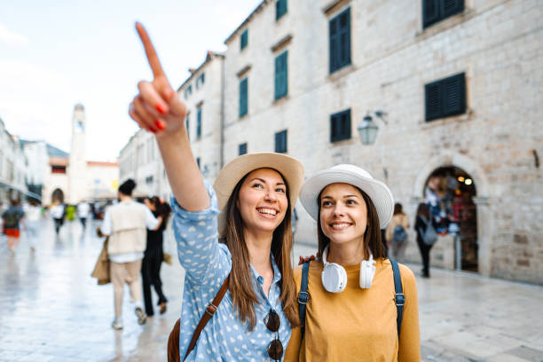 istock Two young female tourists exploring the city 1493596395