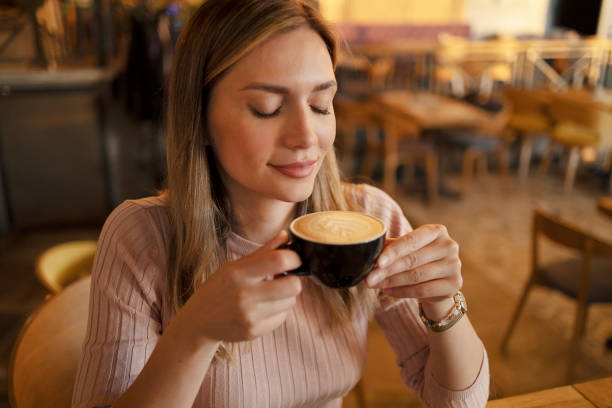 istock Woman Smelling Freshly Brewed Coffee 1493608687