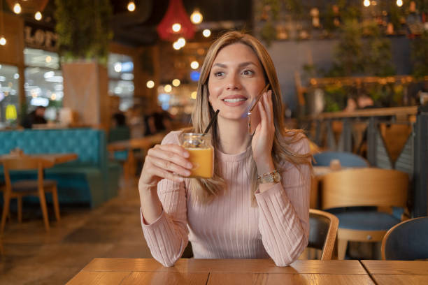 istock Coffee Shop Portrait With Phone Call 1493608860