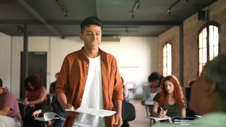 Student giving educational exam to the teacher