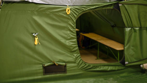 istock An army-issue mobile shower unit designed for use in the field. A compact and transportable military bath capable of being set up anywhere. 1493625311