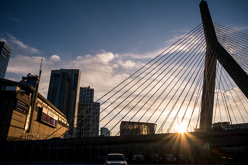 Boston, USA - Mar 6th, 2023: The waterfront and the Zakim Bunker Hill Memorial Bridge at sunset.