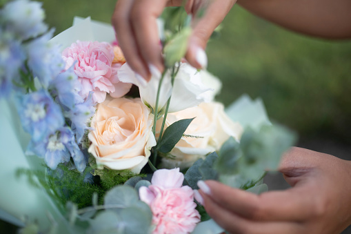 Beautiful bouquet with pink carnations and roses close-up