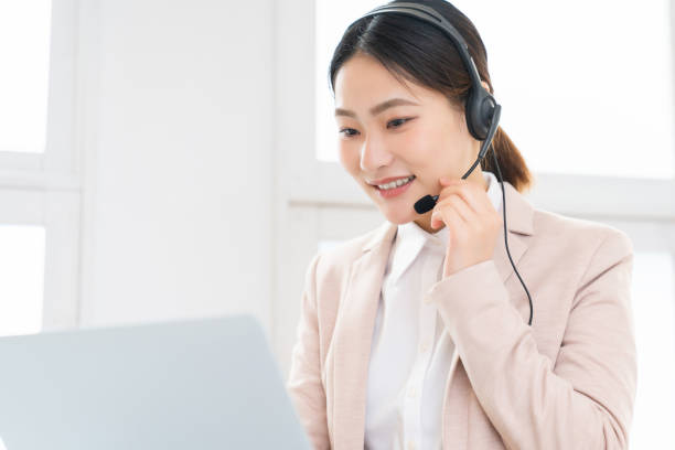 istock attractive asian woman who works as an operator 1493631940