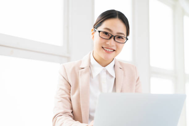 istock young asian businesswoman using laptop 1493638841