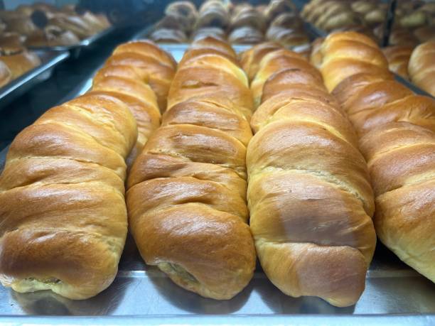 istock Bread roll stuffed with banana in a bakery for sale 1493647521