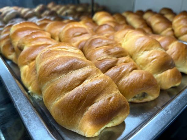 istock Bread roll stuffed with banana in a bakery for sale 1493647554