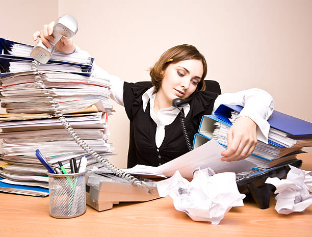 istock Young businesswoman with tons of documents 149364951