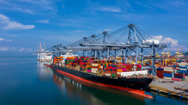 istock Aerial view container cargo ship in import export global business commercial trade logistic transportation of international by container cargo ship, Container cargo freight shipping at industrial port 1493656549