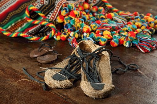 espadrilles, castanets and spanish manta on the wooden background