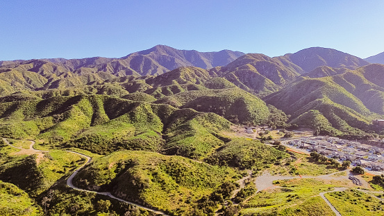 Drone flight over the Santa Ana mountains during spring show the beauty of Spring. With the heavy winter precipitation, spring has bought forth lush foliage.