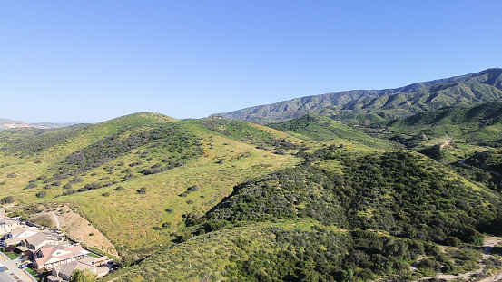 Drone flight over the Santa Ana mountains during spring show the beauty of Spring. With the heavy winter precipitation, spring has bought forth lush foliage.