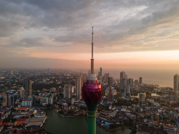 Lotus Tower , Colombo , Sri Lanka The Lotus Tower is an iconic telecommunications and observation tower in Colombo, Sri Lanka. Standing at approximately 356 meters (1,168 feet), it is one of the tallest towers in South Asia. Its design is inspired by the lotus flower, symbolizing purity and unity. The tower serves as a hub for broadcasting and telecommunication services and offers a panoramic view of Colombo from its circular observation deck. It represents a symbol of modernity and progress for Sri Lanka and is a popular tourist attraction. sri lanka skyline stock pictures, royalty-free photos & images