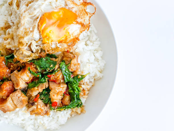 istock Rice topped with crispy pork belly with Thai basil and fried egg 1493670947