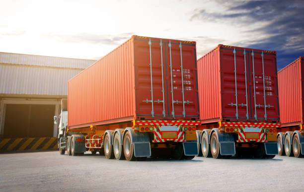 istock Semi Trailer Trucks on The Parking Lot. Trucks Loading at Dock Warehouse. Shipping Cargo Container Delivery Trucks. Distribution Warehouse. Freight Trucks Cargo Transport. Warehouse Logistics. 1493674753