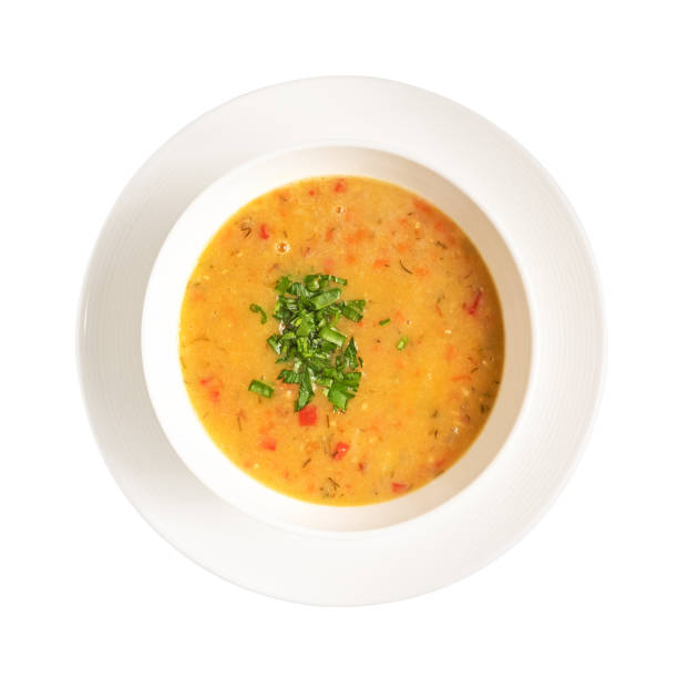 istock Pea soup in bowl on a plate, isolated on white. photo for the menu 1493675882