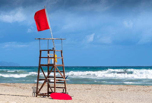 Life guard seat at beach against dramatic sky, Mallorca Son Serra de Marina