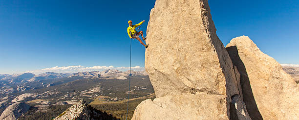 Rock climber on the edge. stock photo